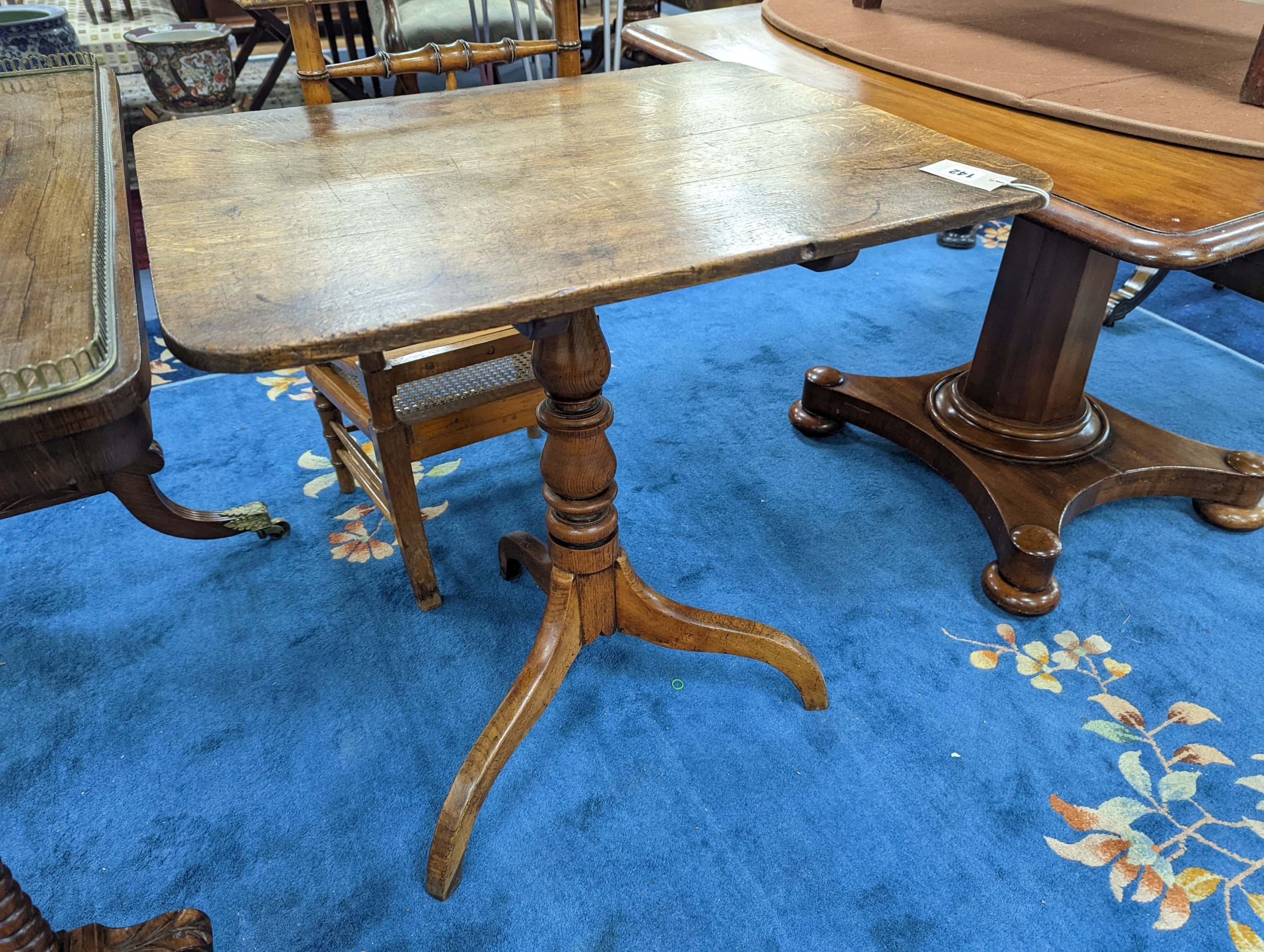 A Victorian rectangular oak tilt top tripod tea table, width 67cm, depth 56cm, height 74cm